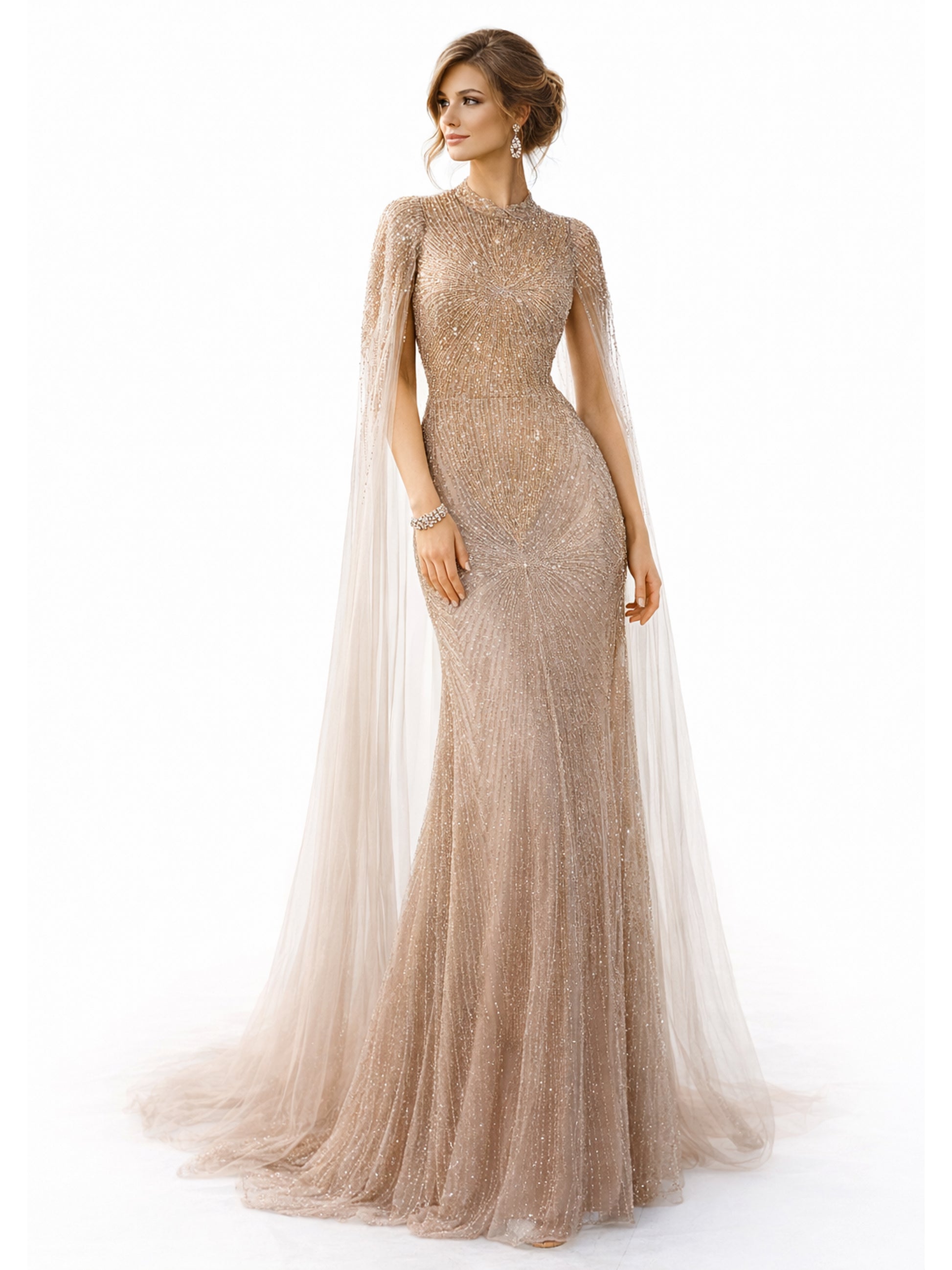 Woman wearing a long, elegant gold dress with a sheer overlay on a white background